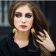 Jewelry model with golden tree ring and earrings