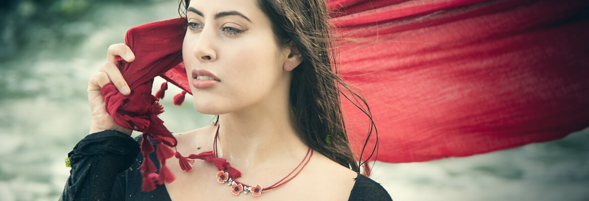 Jewelry model with red poppies necklace