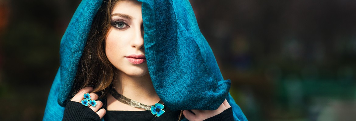 Jewelry model with turquoise poppy ring and necklace